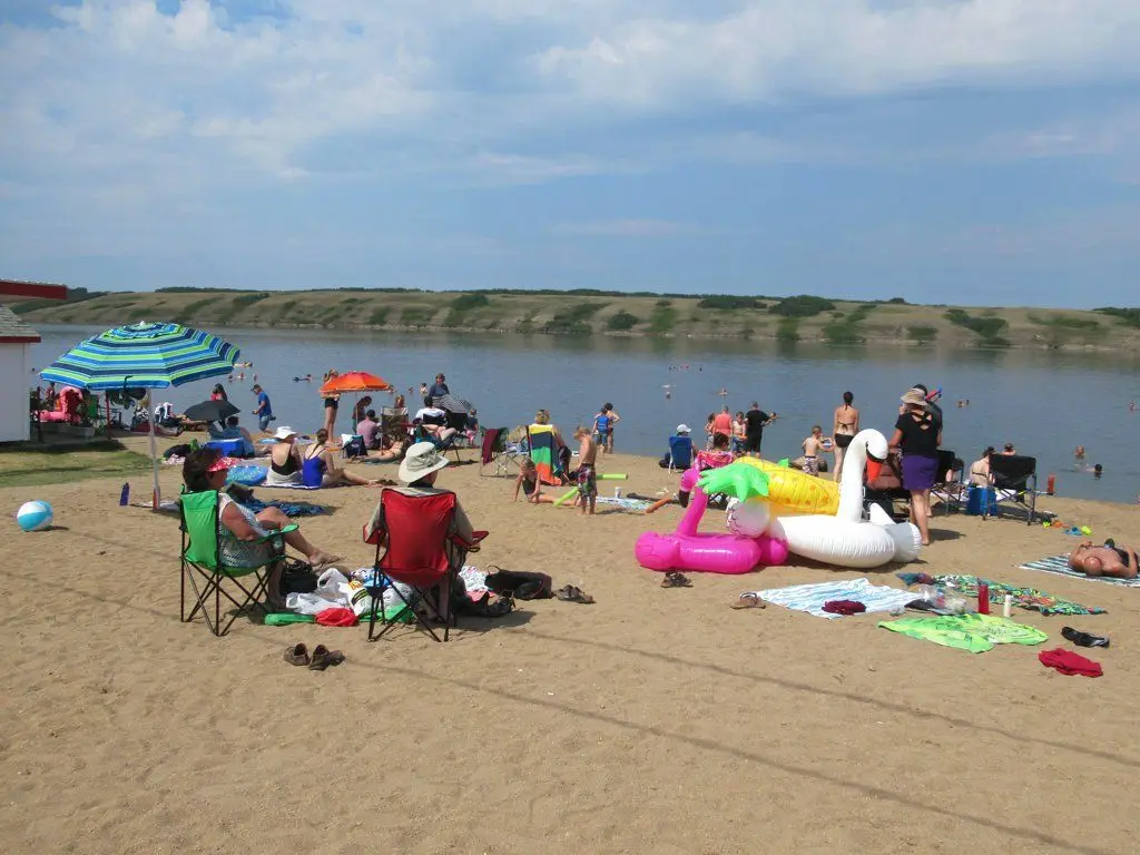 Summer crowd at the beach on Little Manitou Lake