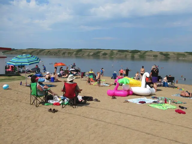 Summer crowd at the beach on Little Manitou Lake