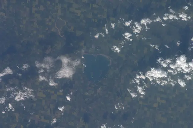 Aerial view of Little Manitou Lake and surrounding farmland from space